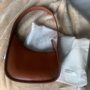 the row half moon bag